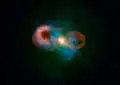 Teacup Galaxy SDSS 1430 +13 with images from Hubble (blue) and the Very Large Array (orange), showing both bubbles