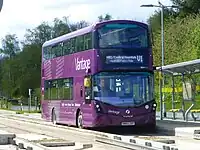 Level-boarding onto a double-decker bus on the Leigh-Salford-Manchester Bus Rapid Transit