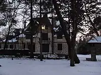 A villa in winter with pines