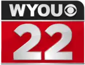 A black rectangle with a rounded upper right-hand corner containing the letters W Y O U next to the CBS eye, all in silver. Beneath, with silver trim top and bottom, is a red rectangle with a silver sans serif numeral "22".
