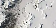Romer Lake's Elephant Foot Glacier in the Earth's Arctic, as seen by Landsat 8.  This picture shows several glaciers that have the same shape as many features on Mars that are believed to also be glaciers.