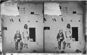 The man seated left is a Zuni with albinism. The Zuni people and other indigenous tribes of the American Southwest have a very high incidence of albinism..mw-parser-output cite.citation{font-style:inherit;word-wrap:break-word}.mw-parser-output .citation q{quotes:"\"""\"""'""'"}.mw-parser-output .citation:target{background-color:rgba(0,127,255,0.133)}.mw-parser-output .id-lock-free.id-lock-free a{background:url("//upload.wikimedia.org/wikipedia/commons/6/65/Lock-green.svg")right 0.1em center/9px no-repeat}body:not(.skin-timeless):not(.skin-minerva) .mw-parser-output .id-lock-free a{background-size:contain}.mw-parser-output .id-lock-limited.id-lock-limited a,.mw-parser-output .id-lock-registration.id-lock-registration a{background:url("//upload.wikimedia.org/wikipedia/commons/d/d6/Lock-gray-alt-2.svg")right 0.1em center/9px no-repeat}body:not(.skin-timeless):not(.skin-minerva) .mw-parser-output .id-lock-limited a,body:not(.skin-timeless):not(.skin-minerva) .mw-parser-output .id-lock-registration a{background-size:contain}.mw-parser-output .id-lock-subscription.id-lock-subscription a{background:url("//upload.wikimedia.org/wikipedia/commons/a/aa/Lock-red-alt-2.svg")right 0.1em center/9px no-repeat}body:not(.skin-timeless):not(.skin-minerva) .mw-parser-output .id-lock-subscription a{background-size:contain}.mw-parser-output .cs1-ws-icon a{background:url("//upload.wikimedia.org/wikipedia/commons/4/4c/Wikisource-logo.svg")right 0.1em center/12px no-repeat}body:not(.skin-timeless):not(.skin-minerva) .mw-parser-output .cs1-ws-icon a{background-size:contain}.mw-parser-output .cs1-code{color:inherit;background:inherit;border:none;padding:inherit}.mw-parser-output .cs1-hidden-error{display:none;color:#d33}.mw-parser-output .cs1-visible-error{color:#d33}.mw-parser-output .cs1-maint{display:none;color:#2C882D;margin-left:0.3em}.mw-parser-output .cs1-format{font-size:95%}.mw-parser-output .cs1-kern-left{padding-left:0.2em}.mw-parser-output .cs1-kern-right{padding-right:0.2em}.mw-parser-output .citation .mw-selflink{font-weight:inherit}html.skin-theme-clientpref-night .mw-parser-output .cs1-maint{color:#18911F}html.skin-theme-clientpref-night .mw-parser-output .cs1-visible-error,html.skin-theme-clientpref-night .mw-parser-output .cs1-hidden-error{color:#f8a397}@media(prefers-color-scheme:dark){html.skin-theme-clientpref-os .mw-parser-output .cs1-visible-error,html.skin-theme-clientpref-os .mw-parser-output .cs1-hidden-error{color:#f8a397}html.skin-theme-clientpref-os .mw-parser-output .cs1-maint{color:#18911F}}Yi, Z; Garrison, N; Cohen-Barak, O; Karafet, TM; King, RA; Erickson, RP; Hammer, MF; Brilliant, MH (January 2003). "A 122.5-kilobase deletion of the P gene underlies the high prevalence of oculocutaneous albinism type 2 in the Navajo population". American Journal of Human Genetics. 72 (1): 62–72. doi:10.1086/345380. PMC&nbsp;420013. PMID&nbsp;12469324.